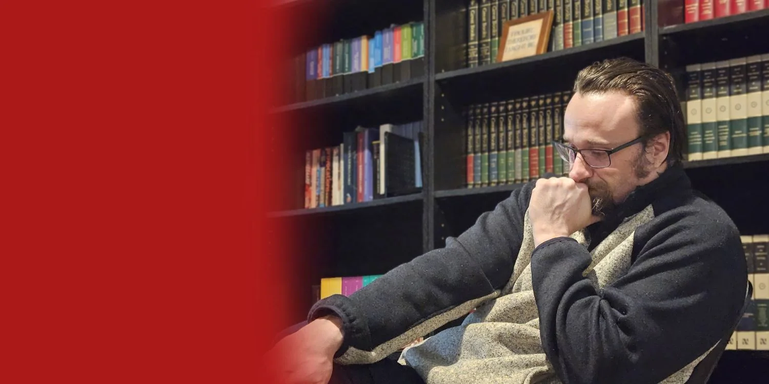 Eric Scot English reading in a library